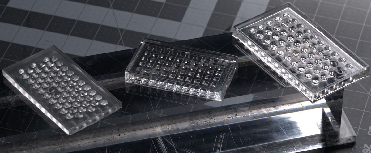 Clear silicone mold cavities on an acrylic riser